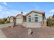 Charming single-story home with desert landscaping and a cozy front patio area at 1706 E Lindrick Dr, Chandler, AZ 85249