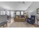 Inviting living area flows into dining space, featuring an open layout and neutral color palette at 1706 E Lindrick Dr, Chandler, AZ 85249