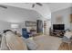 Comfortable living room features vaulted ceiling, carpet, and an abundance of natural light at 1706 E Lindrick Dr, Chandler, AZ 85249