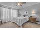 Serene main bedroom features soft lighting, neutral walls, and a comfortable ceiling fan at 1706 E Lindrick Dr, Chandler, AZ 85249