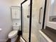 Clean bathroom featuring a corner shower and convenient toilet at 17200 W Bell Rd # 958, Surprise, AZ 85374