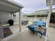 Covered patio featuring cozy seating and outdoor dining area at 17200 W Bell Rd # 958, Surprise, AZ 85374