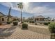 View of several desert homes with brick and concrete pathways, desert landscaping, palm tree and cacti at 1793 E Desert Inn Dr, Chandler, AZ 85249