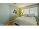 Relaxing bedroom with a large window and comfortable bed, perfect for rest at 1793 E Desert Inn Dr, Chandler, AZ 85249