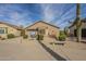 Single story house with desert landscaping, rock ground cover, small shrubbery, and concrete bench at 1793 E Desert Inn Dr, Chandler, AZ 85249