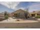 Charming desert home with a spacious driveway and attached carport, framed by native cacti and desert landscaping at 1793 E Desert Inn Dr, Chandler, AZ 85249