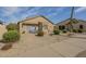 Single story house with desert landscaping, rock ground cover, small shrubbery, and a covered patio at 1793 E Desert Inn Dr, Chandler, AZ 85249