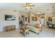 Spacious living room with tile floors, neutral tones, and an open layout connecting to the kitchen and dining area at 1793 E Desert Inn Dr, Chandler, AZ 85249