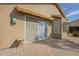 Back patio featuring neutral stucco, brick pavers, and a sliding glass door for outdoor enjoyment at 1793 E Desert Inn Dr, Chandler, AZ 85249