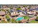 A high-angle aerial view of the home displaying the backyard's private pool, RV parking, and putting green at 18225 W Mackenzie Dr, Goodyear, AZ 85395