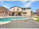 Beautiful backyard showcasing a sparkling pool and covered patio perfect for outdoor living at 18225 W Mackenzie Dr, Goodyear, AZ 85395