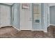 Bright entryway with tile flooring, white door and trim, and windows providing natural light at 18225 W Mackenzie Dr, Goodyear, AZ 85395