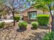 Charming single-story home with a well-maintained front yard and mature landscaping at 18225 W Mackenzie Dr, Goodyear, AZ 85395