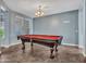 Large game room with a billiard table and a chandelier at 18225 W Mackenzie Dr, Goodyear, AZ 85395