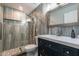 This bathroom is finished with gray tile throughout the walk-in shower and vanity at 1830 N 87Th Ter, Scottsdale, AZ 85257