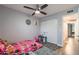 Bedroom with wood-look floors, ceiling fan, and closet with sliding doors at 1830 N 87Th Ter, Scottsdale, AZ 85257