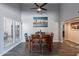 Dining area with high ceilings, modern light fixture, and picture window at 1830 N 87Th Ter, Scottsdale, AZ 85257