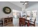 Cozy dining area with seating for six and an adjacent kitchen and living space at 1830 N 87Th Ter, Scottsdale, AZ 85257