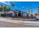 Charming single-story home with a modern fence and a well-manicured front yard, perfect for curb appeal at 1830 N 87Th Ter, Scottsdale, AZ 85257