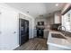 Contemporary kitchen with gray cabinets, stainless steel appliances, and hardwood-style flooring at 1830 N 87Th Ter, Scottsdale, AZ 85257