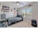 Bedroom including a ceiling fan, decor, a window for natural light, and carpeted flooring at 1896 S Porter St, Gilbert, AZ 85295