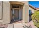 View of covered porch with a small window, and a front door with a Hello doormat at 1896 S Porter St, Gilbert, AZ 85295