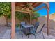 Cozy backyard gazebo with a fire pit table and seating, creating an inviting outdoor space for gatherings at 1896 S Porter St, Gilbert, AZ 85295