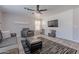 Bright living room with ceiling fan, shiplap accent wall, and neutral decor at 1896 S Porter St, Gilbert, AZ 85295