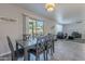 Dining room with sliding glass door opens to the backyard and flows into the living room at 1896 S Porter St, Gilbert, AZ 85295