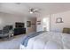 Tranquil bedroom featuring neutral tones, a ceiling fan, and ample space at 1896 S Porter St, Gilbert, AZ 85295