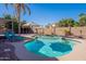 Beautiful backyard pool with lounge chairs, an umbrella, and a gazebo surrounded by well-maintained landscaping at 1896 S Porter St, Gilbert, AZ 85295