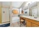 Well-lit bathroom features a shower, bathtub, vanity, and functional layout at 1918 E Williams Dr, Phoenix, AZ 85024