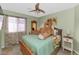 Charming bedroom with a cozy bed, soft colors, and ample natural light at 1918 E Williams Dr, Phoenix, AZ 85024