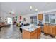 Bright open concept kitchen with granite countertops, a center island, and stainless appliances at 1918 E Williams Dr, Phoenix, AZ 85024