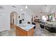 Bright kitchen with a center island, a breakfast bar, and an open layout connecting to the living area at 1918 E Williams Dr, Phoenix, AZ 85024