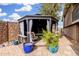 Outdoor gazebo featuring seating, a decorative plant, and a stone wall at 1938 N 67Th St, Mesa, AZ 85205