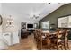 Open concept living room flowing into dining area with hardwood floors at 1938 N 67Th St, Mesa, AZ 85205