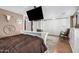 The main bedroom features a ceiling fan, barn door, sliding glass door, and neutral walls at 1938 N 67Th St, Mesa, AZ 85205