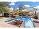 Backyard swimming pool with seating area, umbrellas, and a hot tub at 1938 N 67Th St, Mesa, AZ 85205