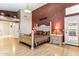 Spacious main bedroom featuring a decorative accent wall and light wood floors at 19927 N 108Th Ln, Sun City, AZ 85373