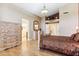 The main bedroom has light wood floors and bright natural light at 19927 N 108Th Ln, Sun City, AZ 85373