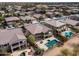 Beautiful aerial view of home with pool, desert landscaping, and covered patio in a Primary planned golf community at 22050 N Balboa Dr, Maricopa, AZ 85138