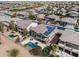 Gorgeous aerial view of home with pool, hot tub, patio, desert landscaping and solar panels in a golf course community at 22050 N Balboa Dr, Maricopa, AZ 85138