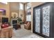 Inviting living room with fireplace, comfortable seating, and natural light from high windows at 22050 N Balboa Dr, Maricopa, AZ 85138