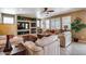 Bright living room with cozy fireplace, stone accent wall and neutral furniture at 22050 N Balboa Dr, Maricopa, AZ 85138