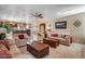 Open living room with staircase view, neutral walls, and tile flooring throughout at 22050 N Balboa Dr, Maricopa, AZ 85138