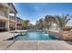 Sparkling pool with water feature and landscaped backyard at 22050 N Balboa Dr, Maricopa, AZ 85138