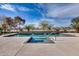 Backyard swimming pool featuring a beautiful design with integrated spa and elegant water features for outdoor enjoyment at 22050 N Balboa Dr, Maricopa, AZ 85138