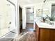 Bathroom featuring dual sinks and a tub/shower combo at 2344 W Barwick Dr, Phoenix, AZ 85085