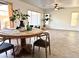 Bright dining area featuring a round wood table, neutral paint, and views of the backyard at 2344 W Barwick Dr, Phoenix, AZ 85085